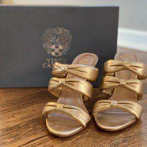 Vince Camuto, Gold slip-on medium heel dress shoe.